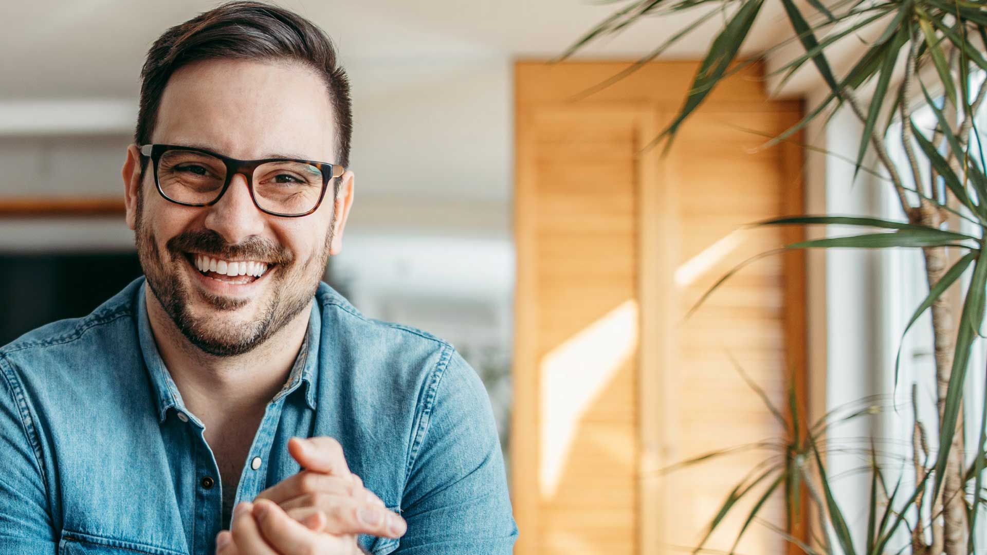 man_smiling_at_desk