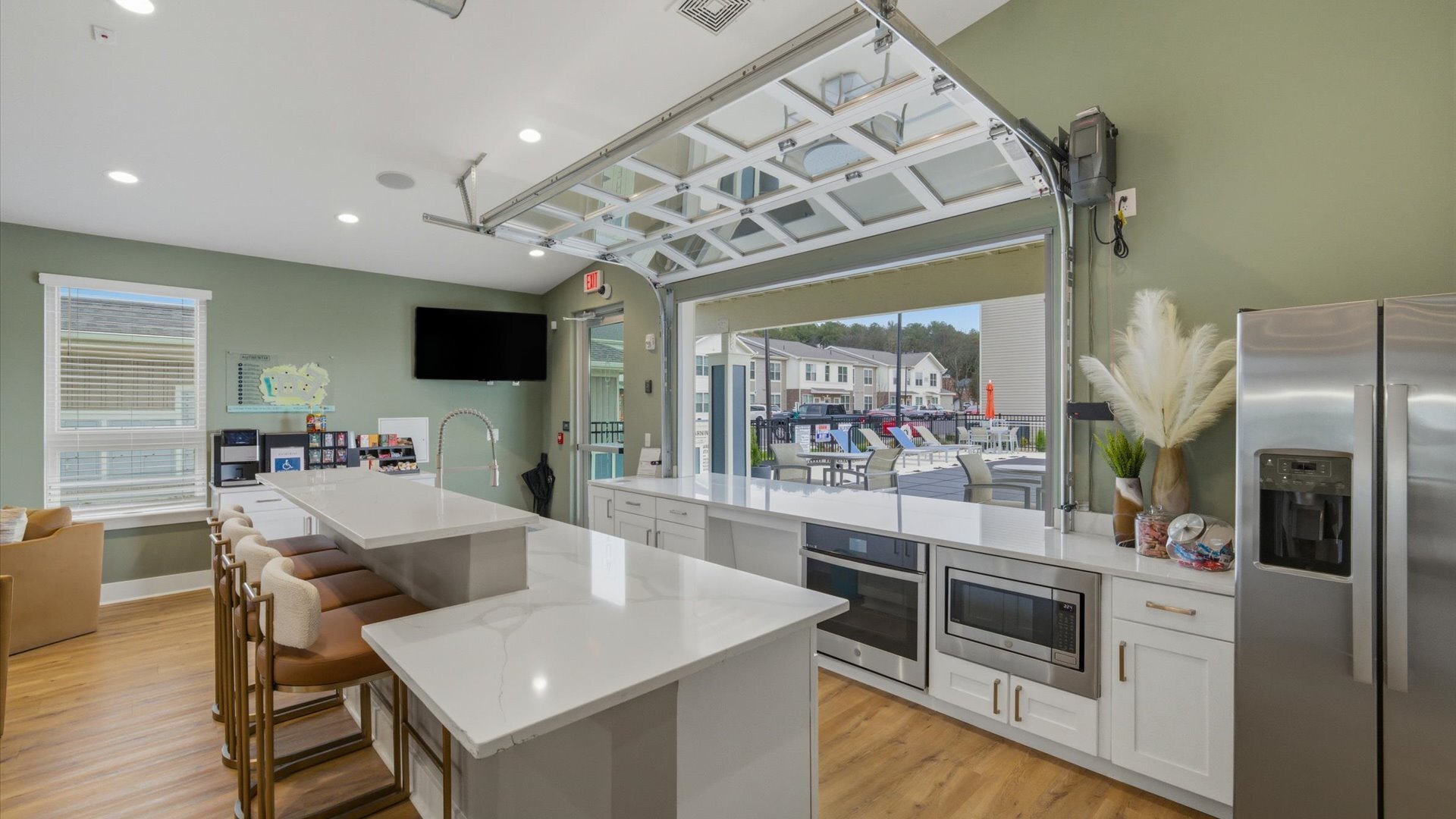 Expansive clubhouse with garage style window at Authentix Town Creek Apartments.
