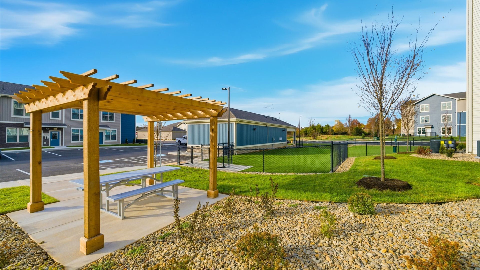 Out door seating next to off leash pet playground at Authentix Town Creeks with pet friendly apartments for rent.